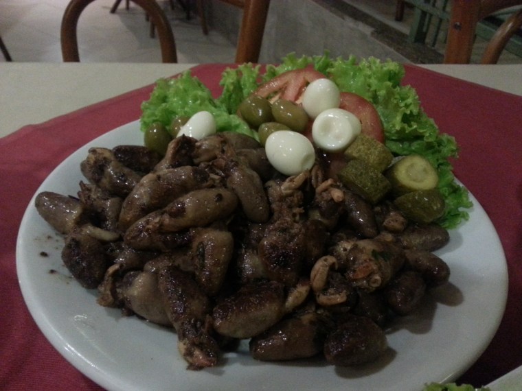 Fried chicken hearts with cilantro.