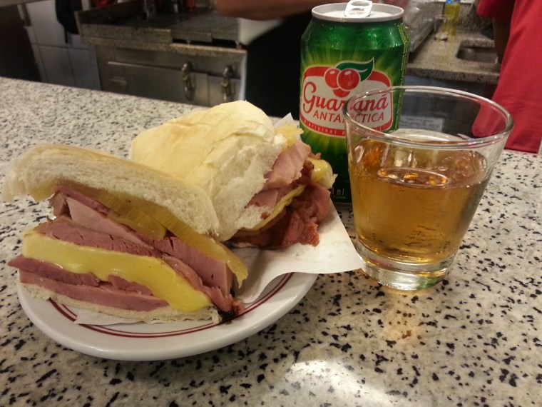 Honey ham, provolone and pineapple sandwich with guarana soda
